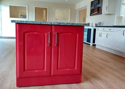 A red kitchen base cabinet