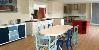 The Matt Finish Kitchen Respray Showroom showing various kitchen and furniture items.